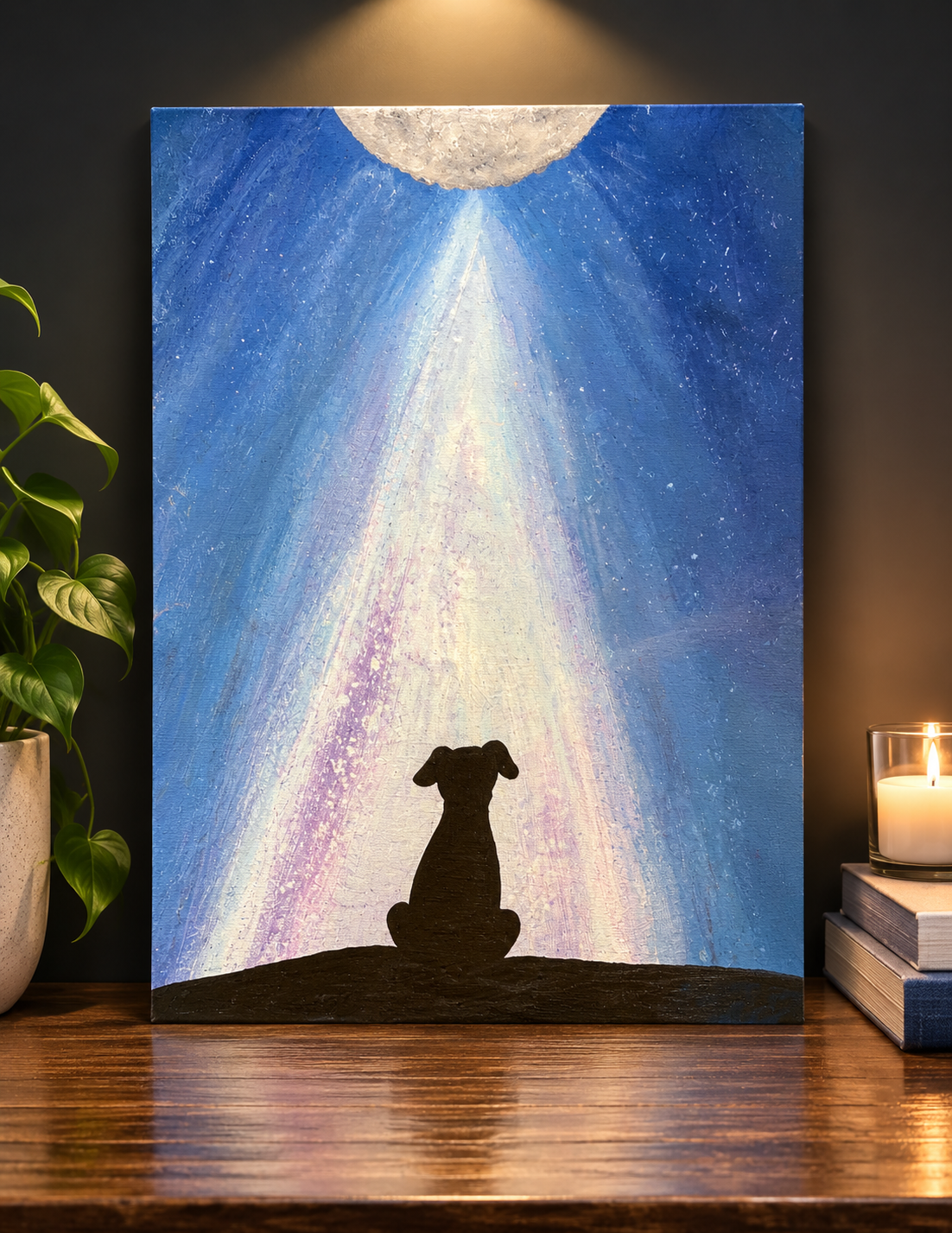 Dog silhouette sitting beneath moonlight in a blue night sky